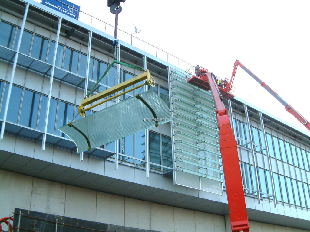 SGT curved laminated Flutex glass facade installed at Paris Charles de Gaulle Airport
